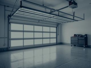 Custom Garage Solutions Project – Clinton UT Modern custom garage door in a clean, spacious Clinton, UT garage installation