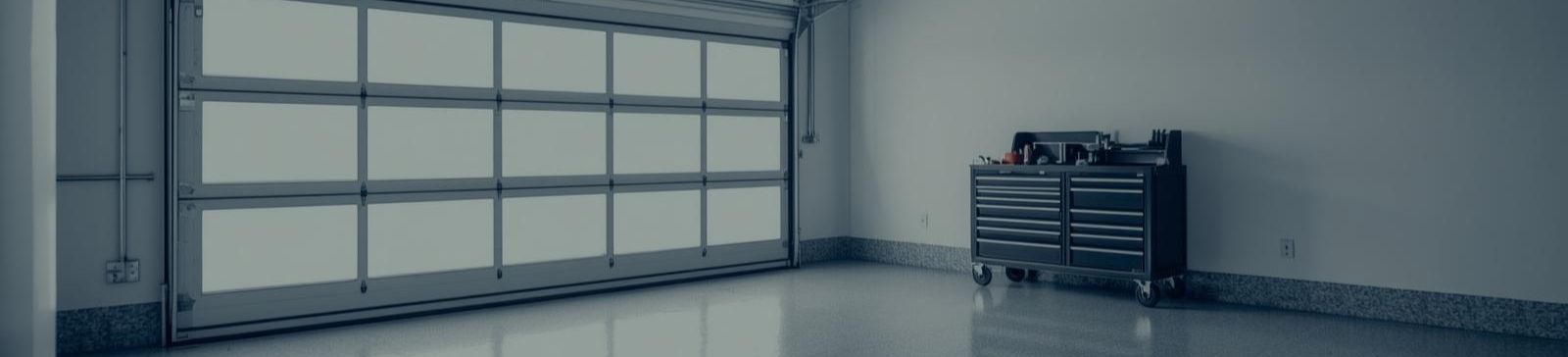Modern custom garage door in a clean, spacious Clinton, UT garage installation